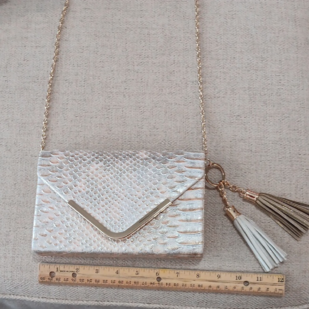 Elegant Cream Clutch with Tassel by Kate Landry